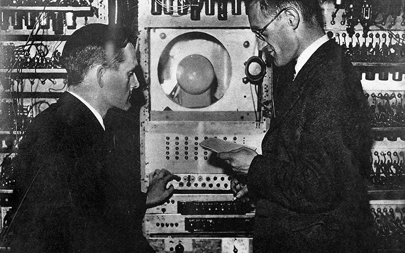 Freddie Williams and his PhD student Tom Kilburn programming the Manchester baby in 1948.